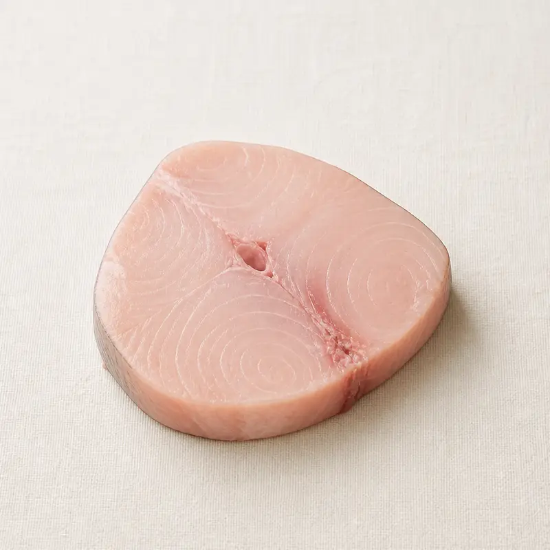 Swordfish, a nutrient-dense seafood food, photographed on a plain linen surface